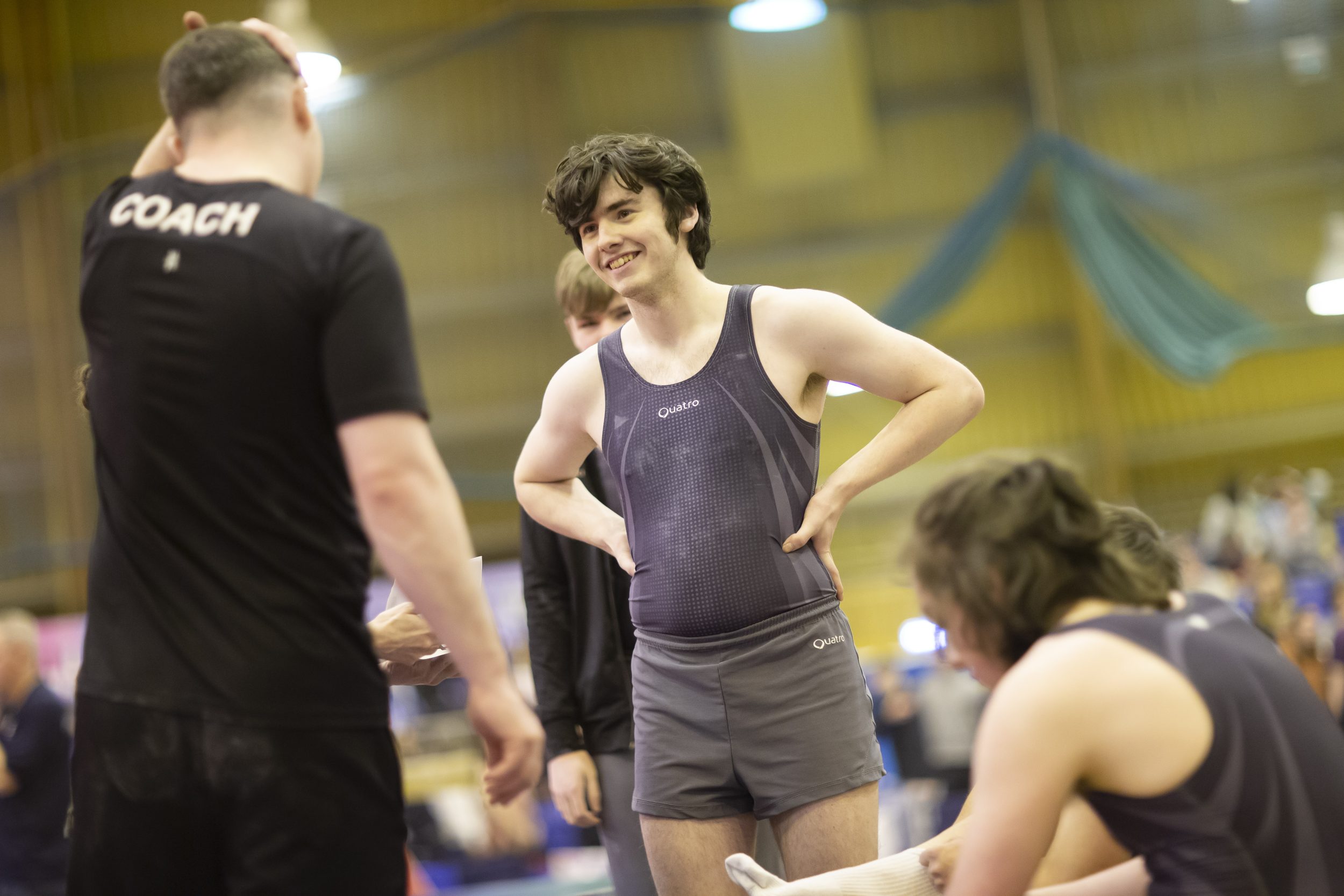 Disability gymnast and his coach at a national championships