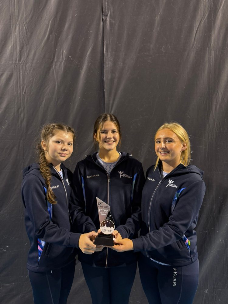 Ruby Robertson, Charlotte McGregor an Olivia Fox holding their silver womens junior tumbling team trophy at the 2025 Loule Cup