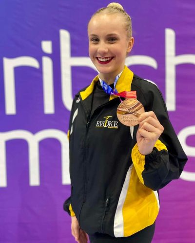 Rhythmic gymnast Cara Mackay posing with bronze medal at British Championships