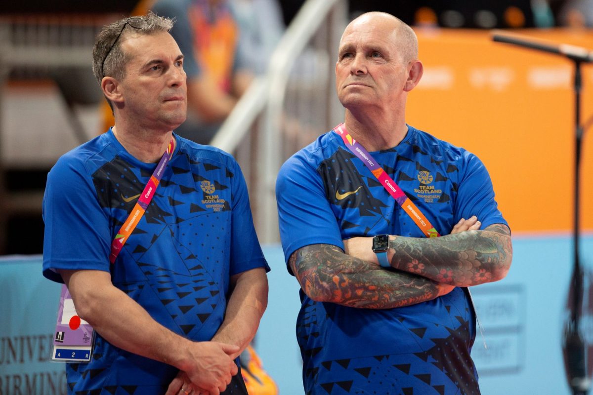 Picture of gymnastics coaches Marius Gherman and John Campell at the Birmingham 2022 Commonwealth Games